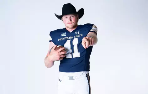 Grebe in hat pointing