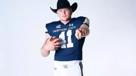 Grebe in hat pointing