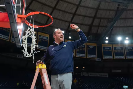 Leon Costello cuts the net