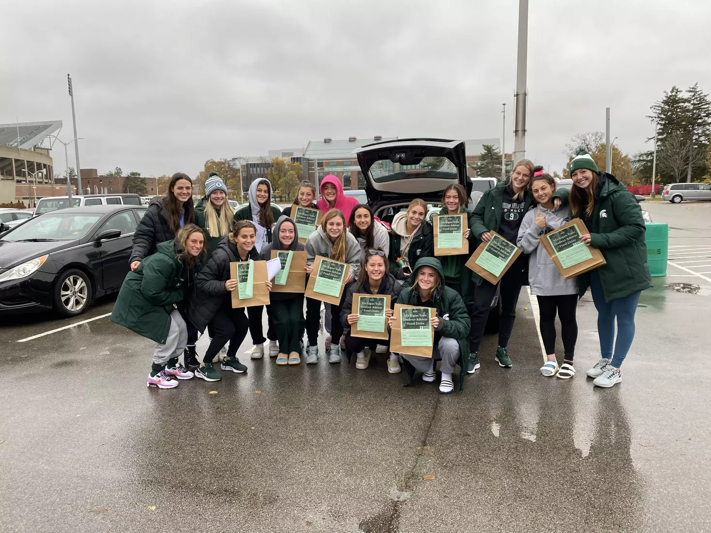 MSU's Student-Athlete Field Drive had volunteers from 12 of MSU's varsity sports and gathered more than 5,000 lbs of food for the Greater Lansing Food Bank.