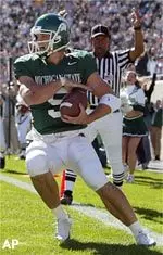 Michigan State quarterback Drew Stanton scores a first-quarter touchdown on an 18-yard pass from receiver Jerramy Scott.