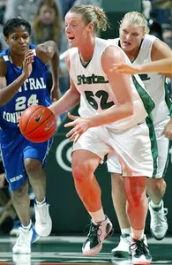 Liz Shimek starts a fast break trailed by Central Connecticut State's Gabriella Geugbelet and Michigan State's Kelli Roehrig during the second half.