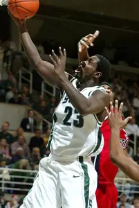 Kelvin Torbert goes to the basket against Delaware State's Terrance Hunter in the second half.
