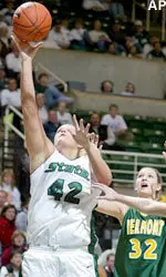 Kelli Roehrig puts up a shot in front of Vermont's Katie McNamara in the first half.