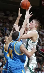 Paul Davis shoots over UCLA's Ryan Hollins and Lorenzo Mata in the second half.