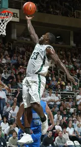 Kelvin Torbert drives to the basket for a layup against North Carolina-Asheville's Chad Mohn.