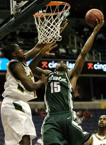 Alan Anderson goes to the basket against George Mason's Folarin Campbell during the first half.