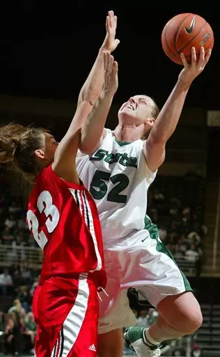 Liz Shimek shoots against Wisconsin's Jordan Wilson in the first half.