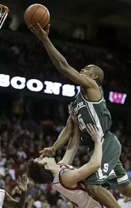 Alan Anderson puts up a shot with Wisconsin's Clayton Hanson defending in the first half.