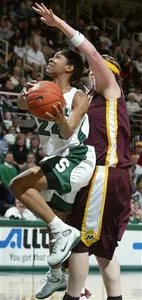Rene Haynes drives to the basket for two of her 17 points during Sunday's 62-49 win over No. 11 Minnesota (AP Photo/Al Goldis).