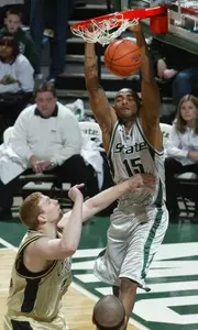 Michigan State's Alan Anderson (15) dunks over Oakland's David Ritzema in the first half Saturday, Jan. 29, 2005, in East Lansing, Mich. (AP Photo/Al Goldis)