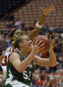 Liz Shimek puts up a shot while being defended by Indiana's Angela Hawkins during the second half.