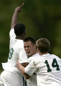Spartans Louis Stephens III, Kenzo Webster, and John Kaczmarek celebrate Webster's goal to put the Spartans up 2-0.