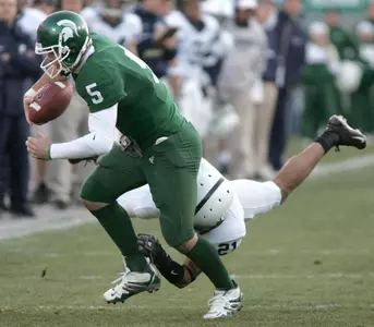 Drew Stanton fights off a tackle by Penn State's Alan Zemaitis. Stanton finished with 233 yards passing.