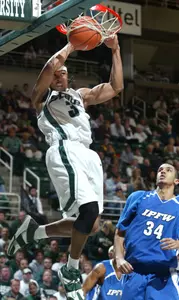 Shannon Brown, left, dunks on an alley-oop over Indiana-Purdue-Fort Wayne's Mohamed Esseghir (34) (AP Photo)