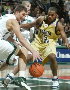 Goran Suton, left, Drew Neitzel, center, and Georgia Tech's Zam Fredrick chase a loose ball.
