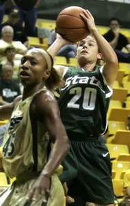 Michigan State's Lindsey Bowen pulls up for a jump-shot behind South Florida's Sharon Cambridge during the second half. Bowen scored 22 points in the win. (AP Photo/Chris O'Meara)