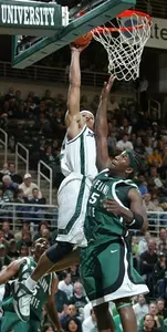 Shannon Brown goes over a Cleveland State defender.