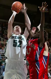 Michigan State's Liz Shimek shoots against Houston's Sha'Ratta Hawkins during the first half. Shimek led Michigan State with 24 points in a 76-53 win. (AP Photo/Al Goldis)