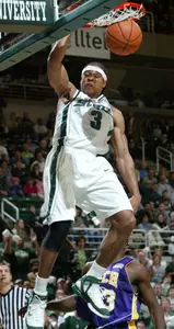 Shannon Brown dunks over Tennessee Tech's Francis Kabore during the first half Wednesday in East Lansing.