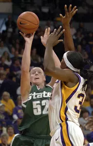 Liz Shimek puts up a shot over LSU's Sylvia Fowles during the first half.
