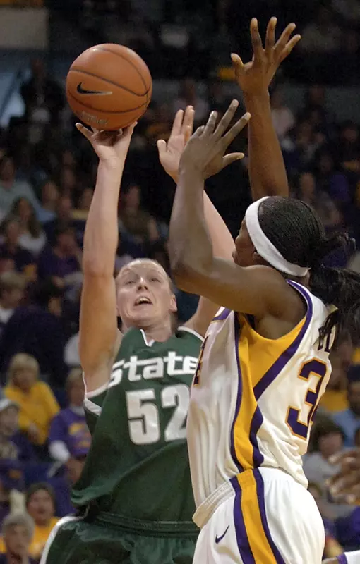 Liz Shimek puts up a shot over LSU's Sylvia Fowles during the first half.