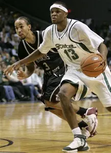 Maurice Ager drives to the basket against Arkansas-Little Rock guard Zack Wright in the second half.