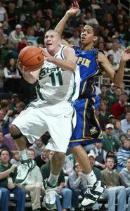 Michigan State's Drew Neitzel puts up a double-pump fast-break shot in front of Coppin State's Tywain McKee during the first half. Michigan State won, 78-54. (AP Photo/Al Goldis)
