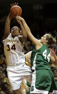 Katrina Grantham guards Minnesota forward Lauren Lacey during the first half