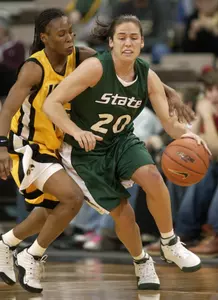 Lindsay Bowen drives past Iowa's Crystal Smith during the second half.