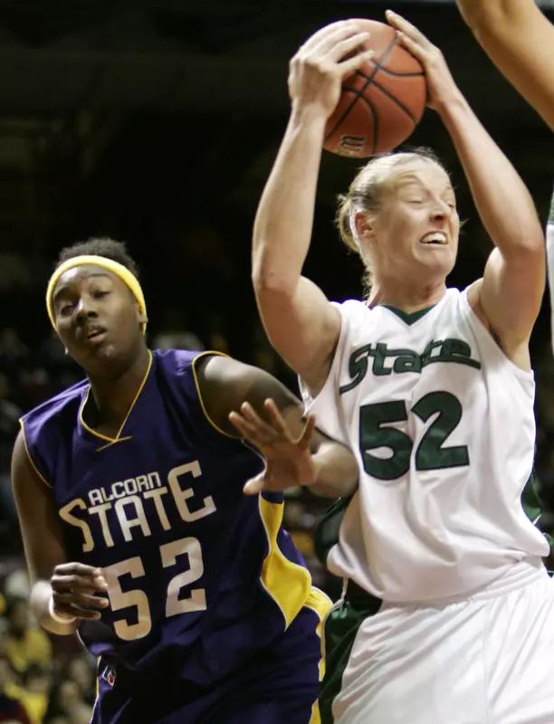 Liz Shimek pulls down a rebound over Alcorn State center Candace Roberts.