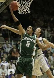 Chris Hill goes up for a layup as Northwestern's Mohamed Hachad defends during the first half.