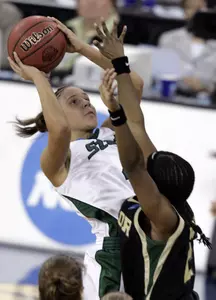 Kristin Haynie shoots over Baylor's Chelsea Whitaker during the first half.