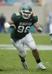 Domata Peko has traveled a long way from his home to play for the Spartans in East Lansing.