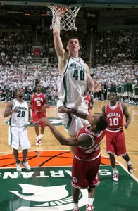 Michigan State's Paul Davis goes up for a dunk over Indiana's Marshall Strickland, bottom, during the first half. (AP Photo/Al Goldis)