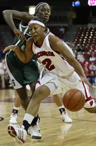 Victoria Lucas-Perry, left, plays defense against Wisconsin's Shari Welton. (File Photo)