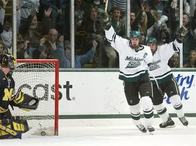 Drew Miller celebrates his first-period goal against Michigan