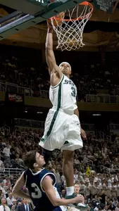 Shannon Brown dunks over Ben Luber for two of his game-high 29 points.