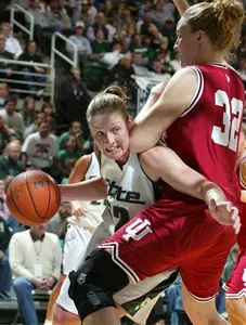 Michigan State's Liz Shimek, left, collides with Indiana's Sarah McKay (32) while driving to the basket during the second half of a college basketball game, Sunday, Jan. 29, 2006, in East Lansing, Mich. Shimek led Michigan State with 17 points in a 65-59 win. (AP Photo/Al Goldis)
