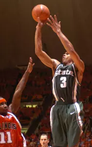 Shannon Brown shoots over the defense of Illinois' Dee Brown in the second half Thursday night in Champaign.