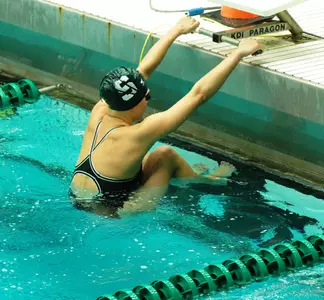 Women defeat Iowa 159.5-140.5