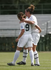 Lauren Hill and Kristi Timar celebrate after a goal against Cincinnati, one of eight Spartan wins in 2006.