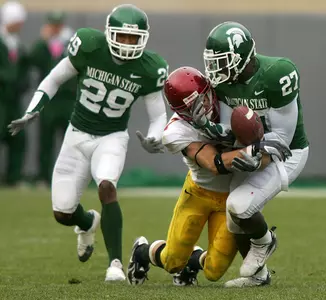 Defensive back SirDarean Adams breaks up a pass intended for Minnesota wide receiver Eric Decker.