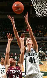 Michigan State center Allyssa DeHaan and Ferris State guard Teghan Thelen go up for a rebound. DeHaan finished the game with 14 rebounds.