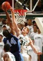 Spartan center Drew Naymick blocks a shot by Bulldogs forward Demetrius Nelson.