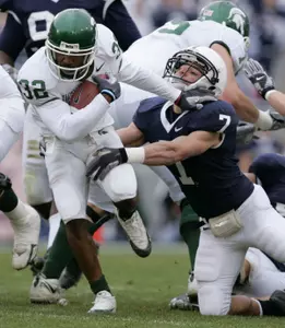 Jerramy Scott pushes Penn State safety Anthony Scirrotto as he rushes through the line during the first half.