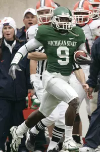 Demond Williams returns an interception for a touchdown against Illinois on Homecoming.