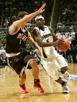 Spartan guard Travis Walton drives around Bear forward Scott Friske.