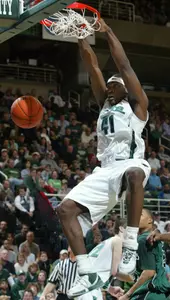 Marquise Gray dunks against Chicago State during the first half.