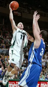 Drew Neitzel shoots over IPFW's Tyler Best in the second half. (AP Photo/Al Goldis)